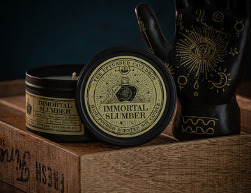 Witchcraft themed Immortal Slumber scented black tinned soy wax candle