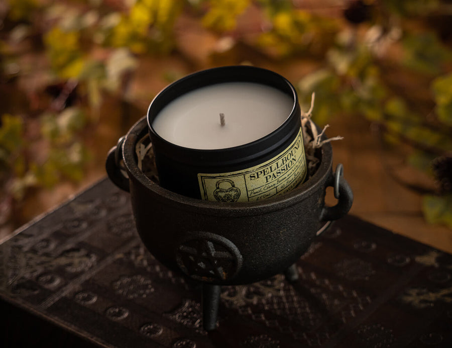 Witchcraft themed Spellbound Passion scented black tinned soy wax candle